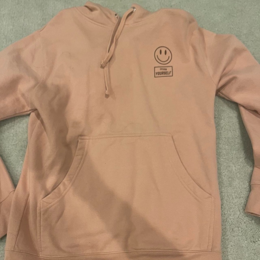 Peach Hoodie with Smiley Face Graphic